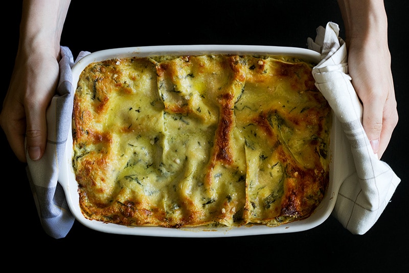 This creamy and cheesy pesto lasagna will blow your mind. You will be screaming "Mamma mia" after tasting it! #pesto #italy #lasagna | cookingtheglobe.com