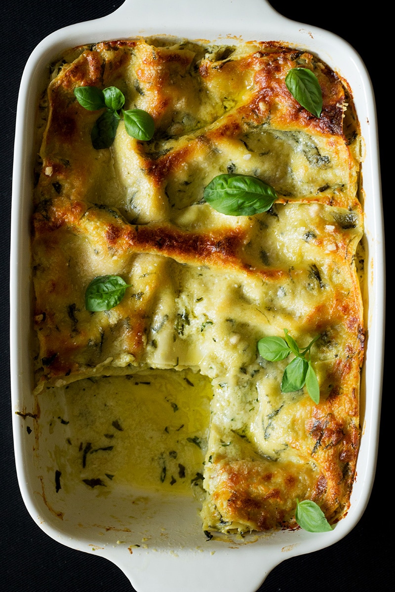 This creamy and cheesy pesto lasagna will blow your mind. You will be screaming "Mamma mia" after tasting it! #pesto #italy #lasagna | cookingtheglobe.com