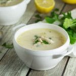This Greek lemon rice soup, called Avgolemono, is both light and creamy. It will brighten your day! #soup #lemon #chicken | cookingtheglobe.com