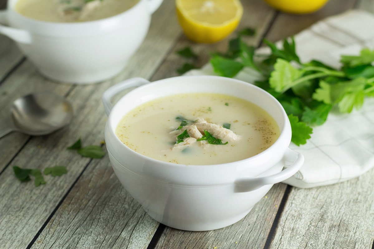 This Greek lemon rice soup, called Avgolemono, is both light and creamy. It will brighten your day! #soup #lemon #chicken | cookingtheglobe.com