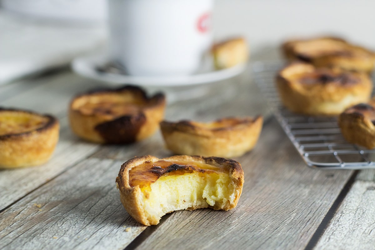 These flaky and creamy Portuguese egg tarts, called Pastel de Nata are melt-in-your-mouth good! | cookingtheglobe.com