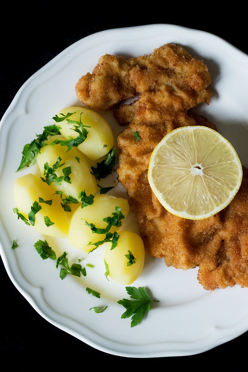 Wiener schnitzel is a traditional Austrian dish made from veal cutlets. It's a perfect easy & quick dinner! #austria #veal | cookingtheglobe.com