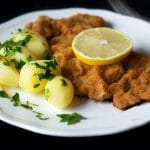 Wiener schnitzel is a traditional Austrian dish made from veal cutlets. It's a perfect easy & quick dinner! #austria #veal | cookingtheglobe.com