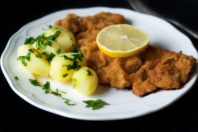 Wiener schnitzel is a traditional Austrian dish made from veal cutlets. It's a perfect easy & quick dinner! #austria #veal | cookingtheglobe.com