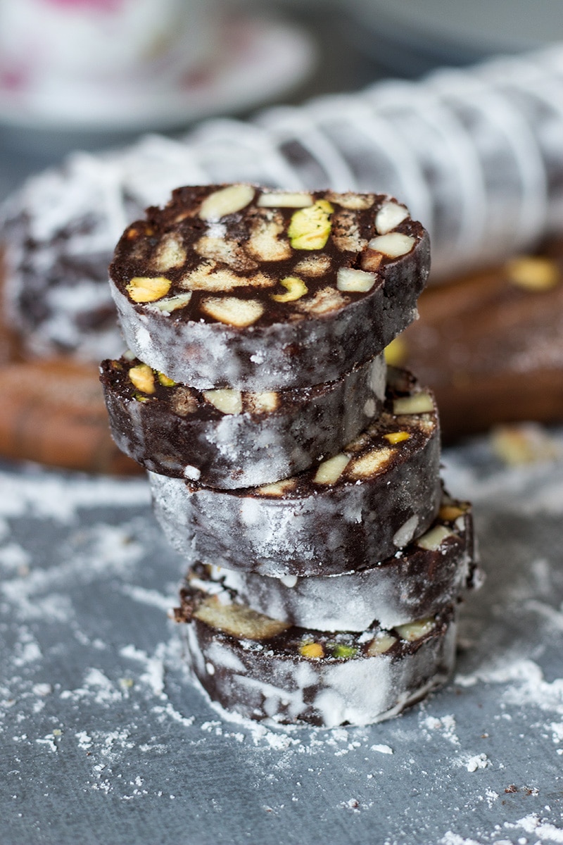 This chocolate dessert called Chocolate Salami comes straight from Italy and is filled with the flavors of chocolate, pistachios, almonds and rum! | cookingtheglobe.com