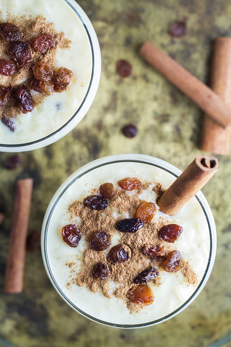 This Mexican Rice Pudding (Arroz Con Leche) is creamy, sweet and easy to make. Sprinkled with cinnamon and raisins! | cookingtheglobe.com