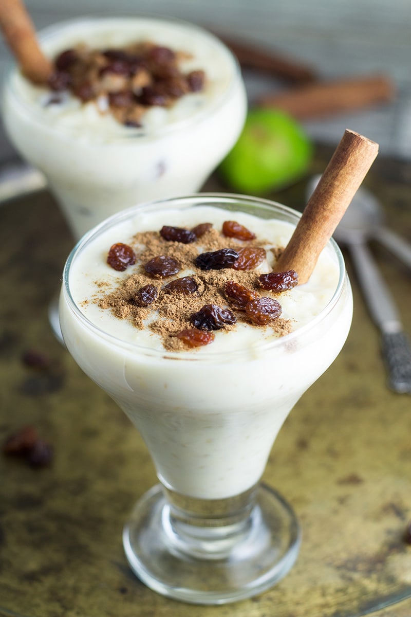 This Mexican Rice Pudding (Arroz Con Leche) is creamy, sweet and easy to make. Sprinkled with cinnamon and raisins! | cookingtheglobe.com