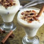 This Mexican Rice Pudding (Arroz Con Leche) is creamy, thick and sweet. Sprinkled with cinnamon and raisins! | cookingtheglobe.com