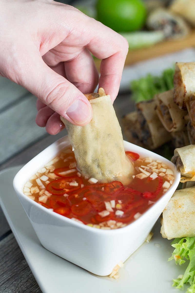 These Vietnamese egg rolls, called Cha Gio, together with the Nuoc Cham dipping sauce make a perfect party appetizer! | cookingtheglobe.com