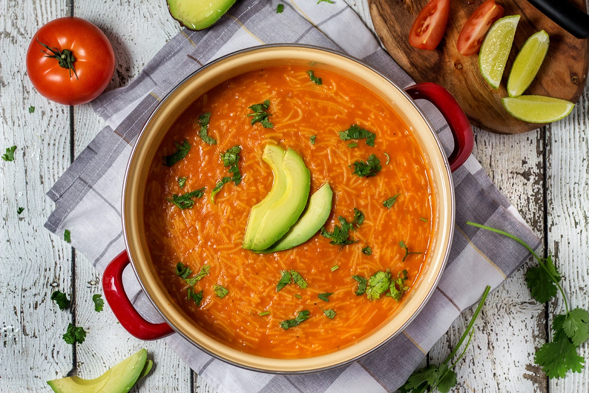 This hearty and comforting Mexican tomato noodle soup, called Sopa de Fideo, is a true feast of flavors! | cookingtheglobe.com