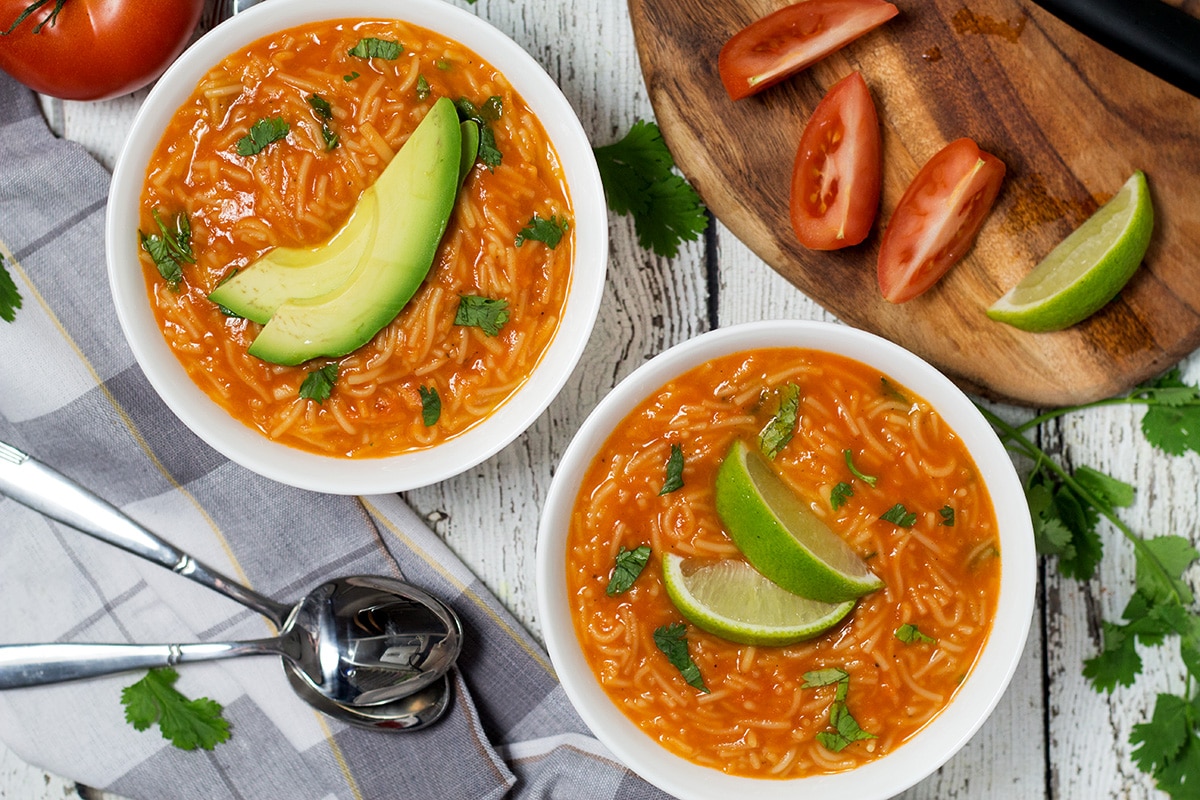 This hearty and comforting Mexican tomato noodle soup, called Sopa de Fideo, is a true feast of flavors! | cookingtheglobe.com
