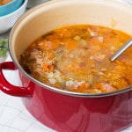 Try this hearty, warming and energizing Polish Sauerkraut Soup with sausage and bacon! | cookingtheglobe.com