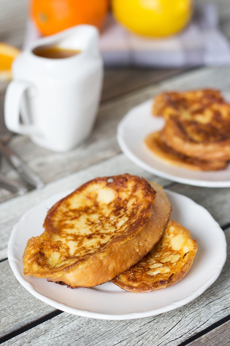 These sweet Spanish toasts, called Torrijas, are soaked in milk and drizzled with an orange-brandy syrup! | cookingtheglobe.com