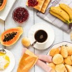 Take a sneak peek at the traditional Brazilian breakfast! It offers coffee, fruit, cheese bread, couscous and other delicious foods!