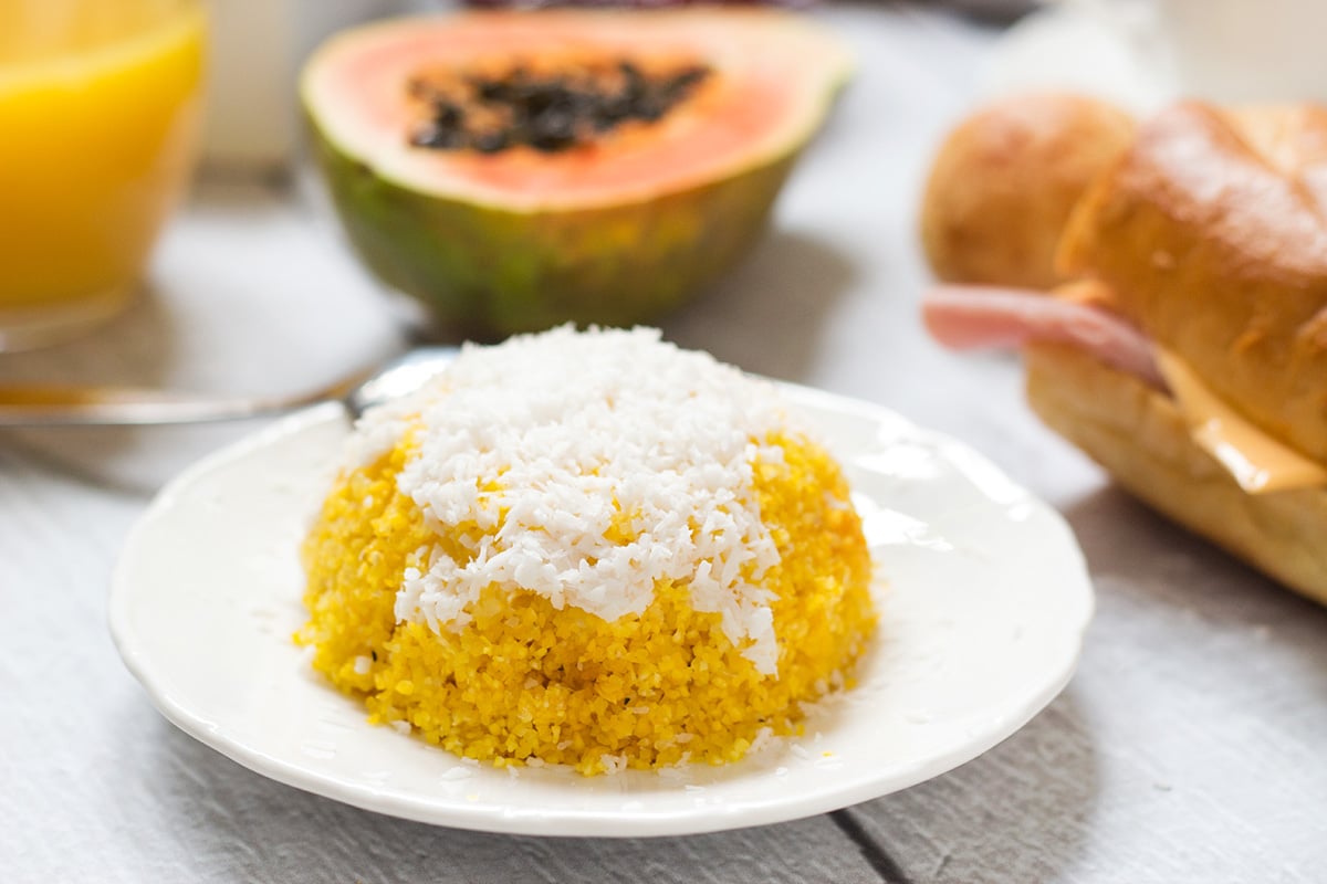 Take a sneak peek at the traditional Brazilian breakfast! It offers coffee, fruit, cheese bread, couscous and other delicious foods! | cookingtheglobe.com