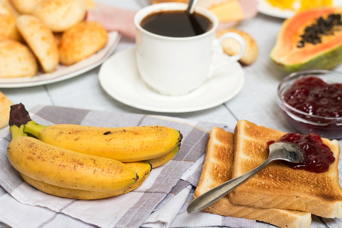 Take a sneak peek at the traditional Brazilian breakfast! It offers coffee, fruit, cheese bread, couscous and other delicious foods! | cookingtheglobe.com