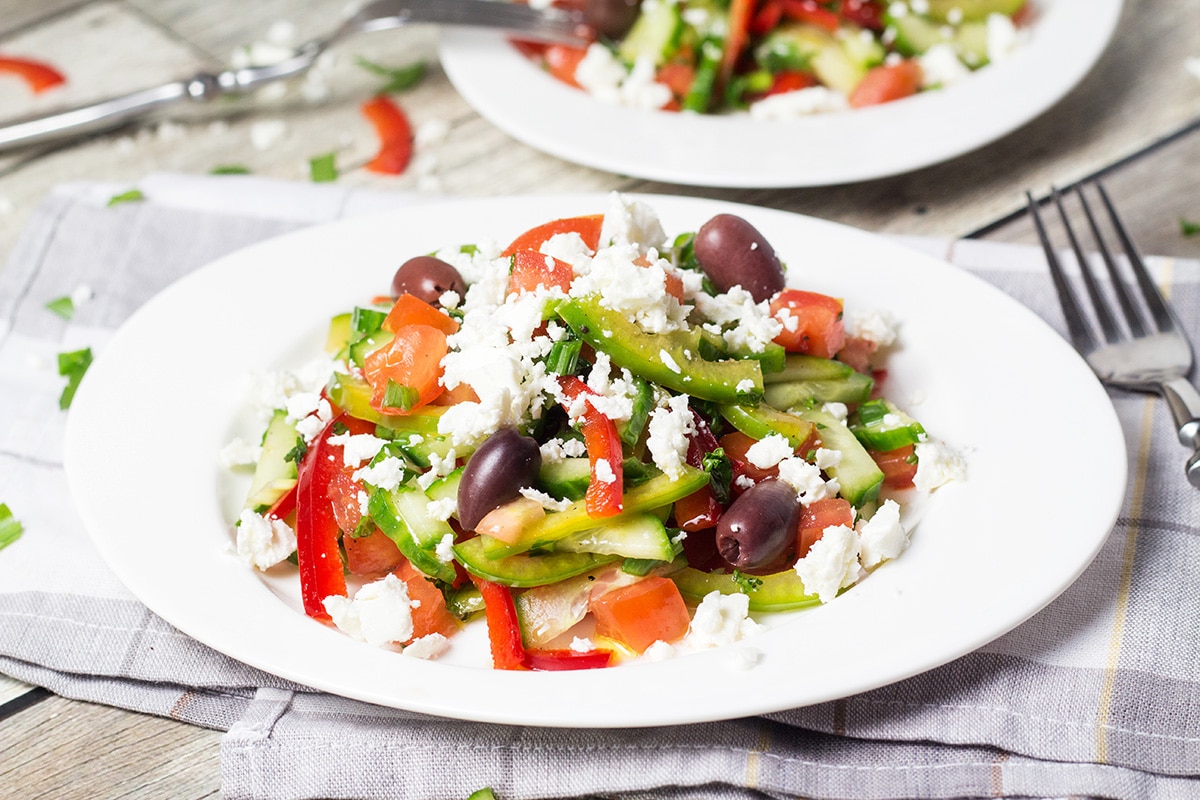 This colorful Bulgarian Shopska Salad is loaded with veggies! Perfect for hot summer days! | cookingtheglobe.com