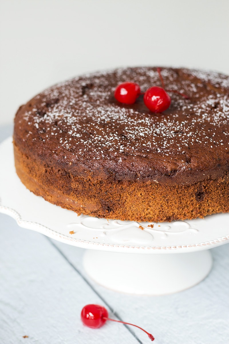 This Jamaican Rum Cake is dark, dense, and filled with rum-soaked dried fruit and Christmassy spices! | cookingtheglobe.com