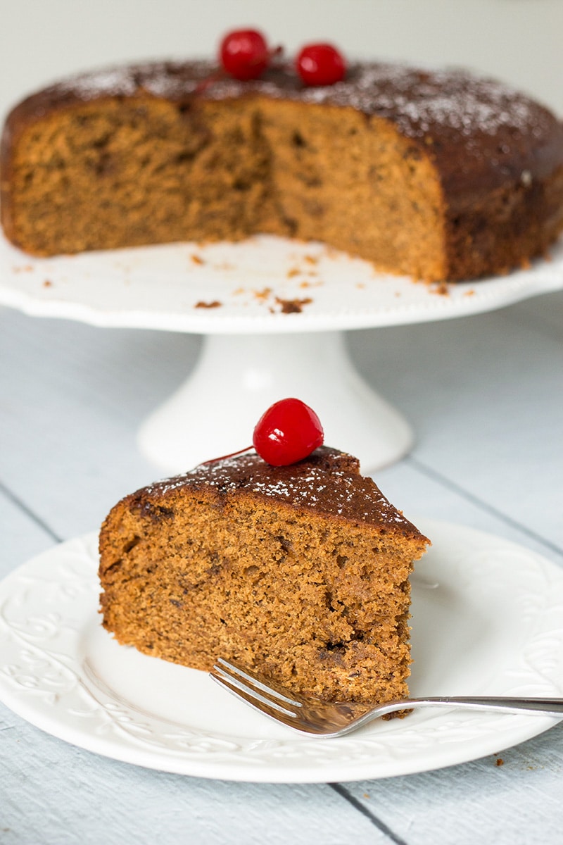 This Jamaican Rum Cake is dark, dense, and filled with rum-soaked dried fruit and Christmassy spices! | cookingtheglobe.com