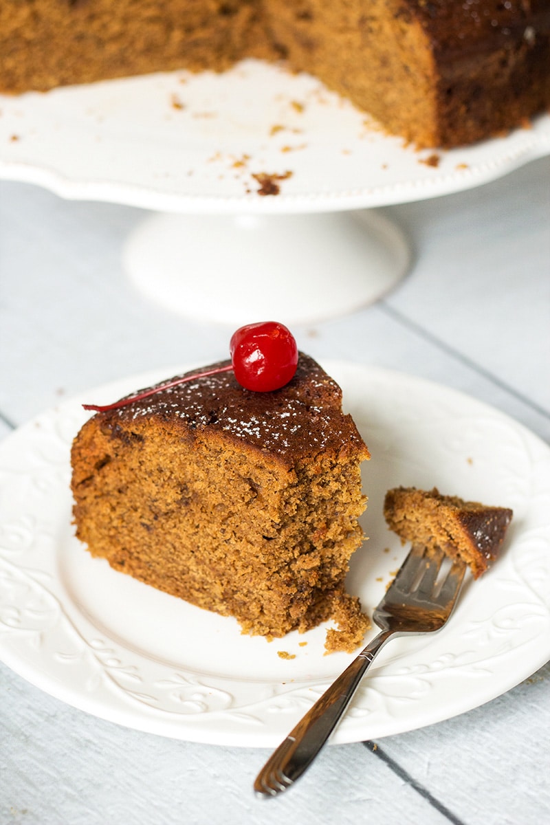 This Jamaican Rum Cake is dark, dense, and filled with rum-soaked dried fruit and Christmassy spices! | cookingtheglobe.com