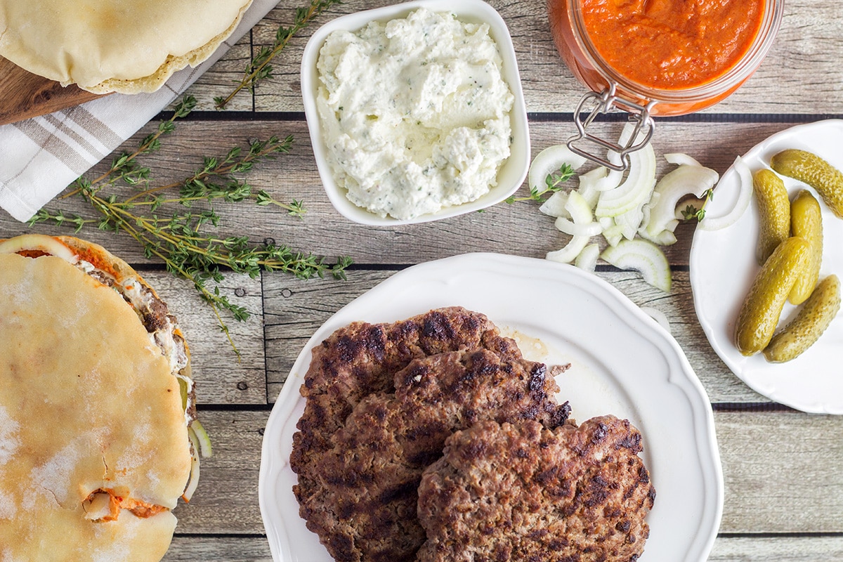 This Serbian burger, called Pljeskavica, will make you forget about all those other burgers from fast food chain places from the very first bite! | cookingtheglobe.com