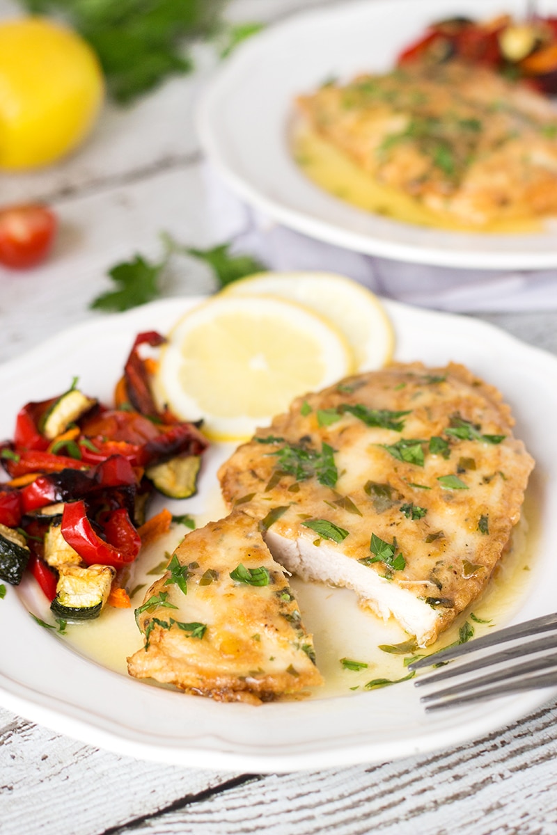 Chicken Francaise is an Italian-American dish consisting of cooked chicken breast cutlets with lemon wine sauce! | cookingtheglobe.com