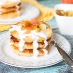 These Cottage Cheese Pancakes come from Russia and are called Syrniki. Served with sour cream and caramelized fruit! | cookingtheglobe.com