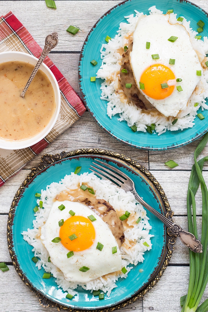 Loco Moco is a popular Hawaiian dish consisting of rice topped with a hamburger patty, fried egg, and drown in a delicious brown gravy!