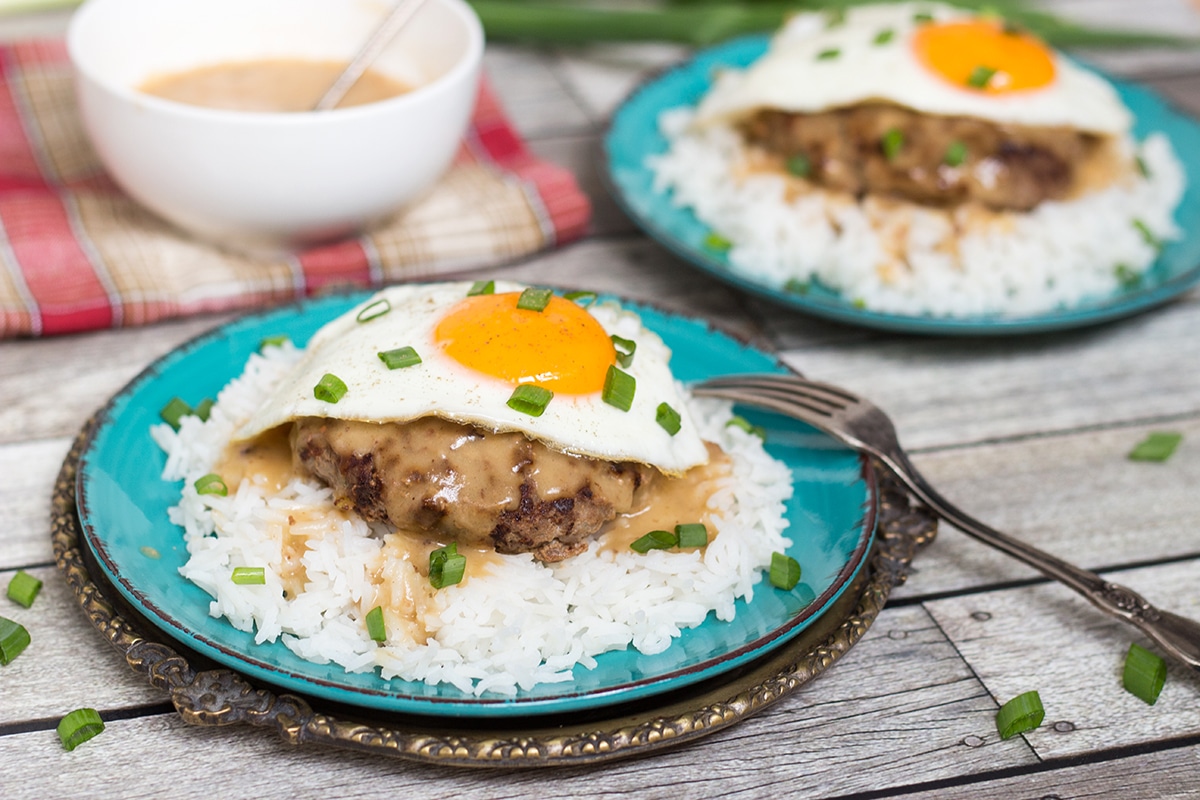 Loco Moco is a popular Hawaiian dish consisting of rice topped with a hamburger patty, fried egg, and drown in a delicious brown gravy!