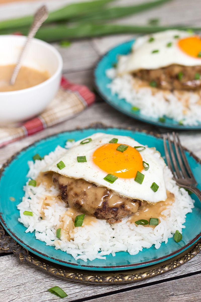 Loco Moco is a popular Hawaiian dish consisting of rice topped with a hamburger patty, fried egg, and drown in a delicious brown gravy!