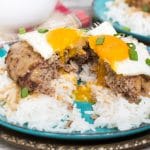 Loco Moco is a popular Hawaiian dish consisting of rice topped with a hamburger patty, fried egg, and drown in a delicious brown gravy!