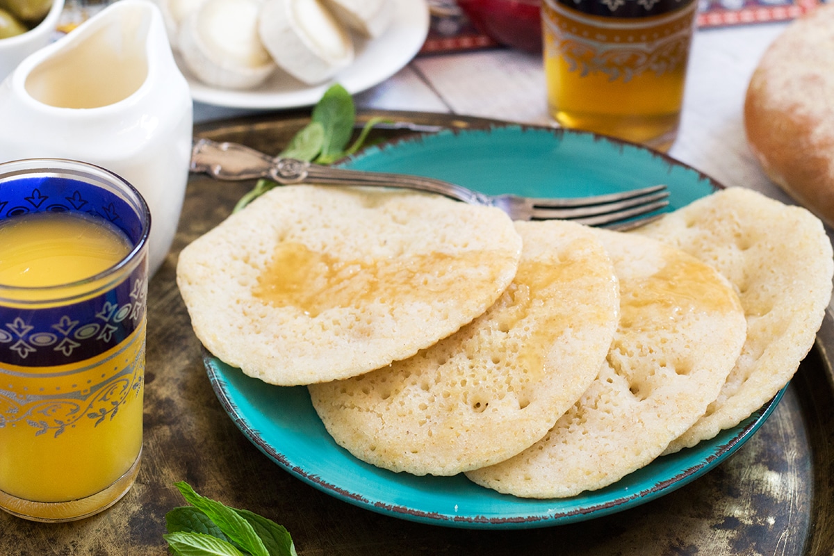 A look at the traditional Moroccan breakfast which features bread, semolina pancakes, fried eggs and the famous mint tea! | cookingtheglobe.com