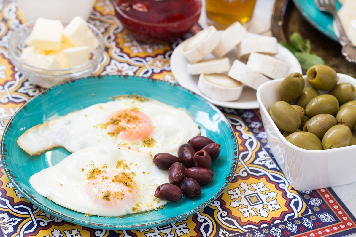 A look at the traditional Moroccan breakfast which features bread, semolina pancakes, fried eggs and the famous mint tea! | cookingtheglobe.com