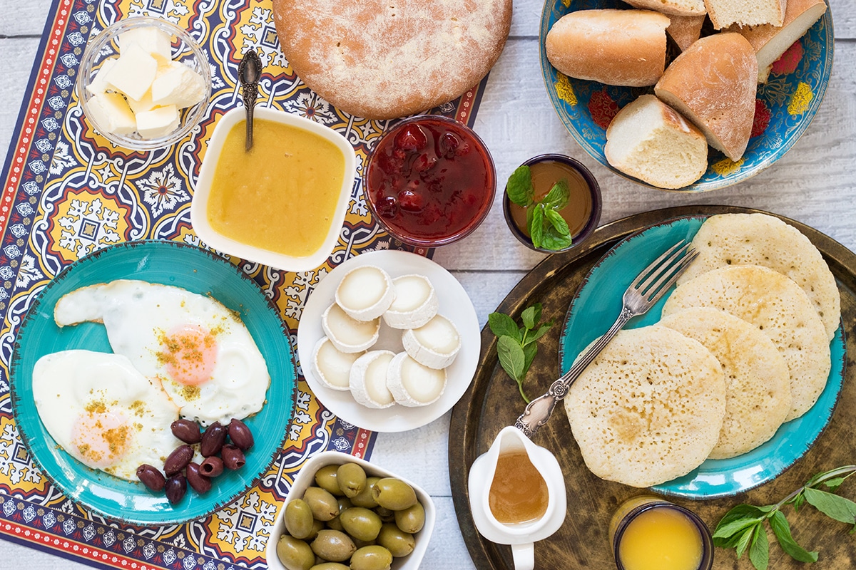 A look at the traditional Moroccan breakfast which features bread, semolina pancakes, fried eggs and the famous mint tea! | cookingtheglobe.com