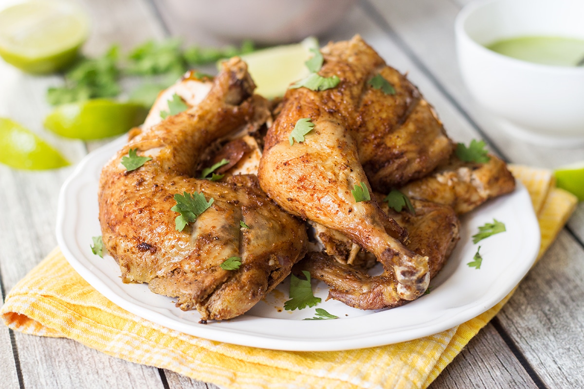 This Peruvian Chicken with a traditional Peruvian green sauce is destined to become one of your favorite chicken recipes ever!