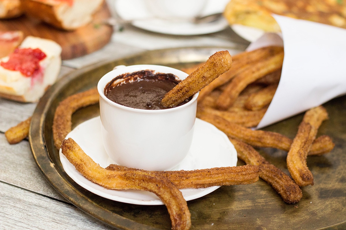 A look at the traditional Spanish breakfast featuring the famous Spanish potato omelette, churros and hot chocolate, and a big variety of delicious sandwiches!