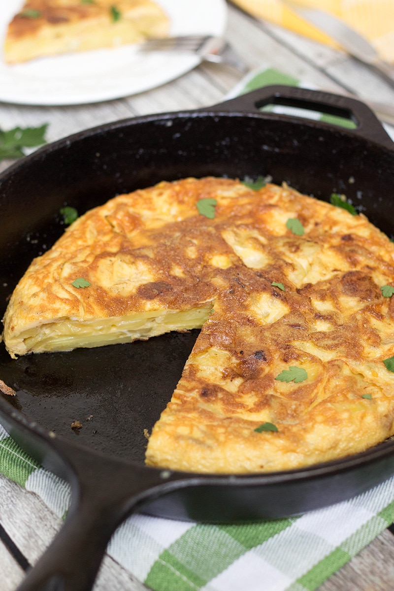 The famous Spanish Omelette (Tortilla) requires only few simple ingredients (eggs, potatoes, onion) and is so delicious!