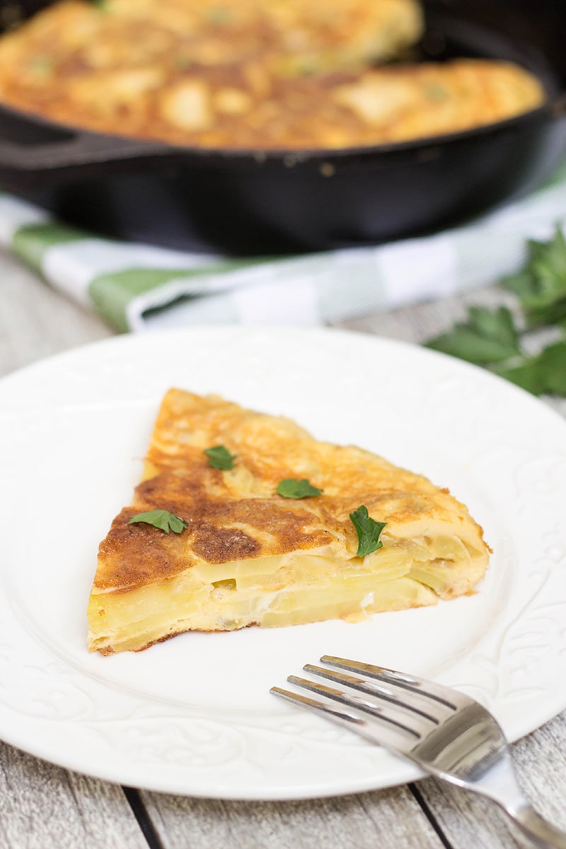 The famous Spanish Omelette (Tortilla) requires only few simple ingredients (eggs, potatoes, onion) and is so delicious!