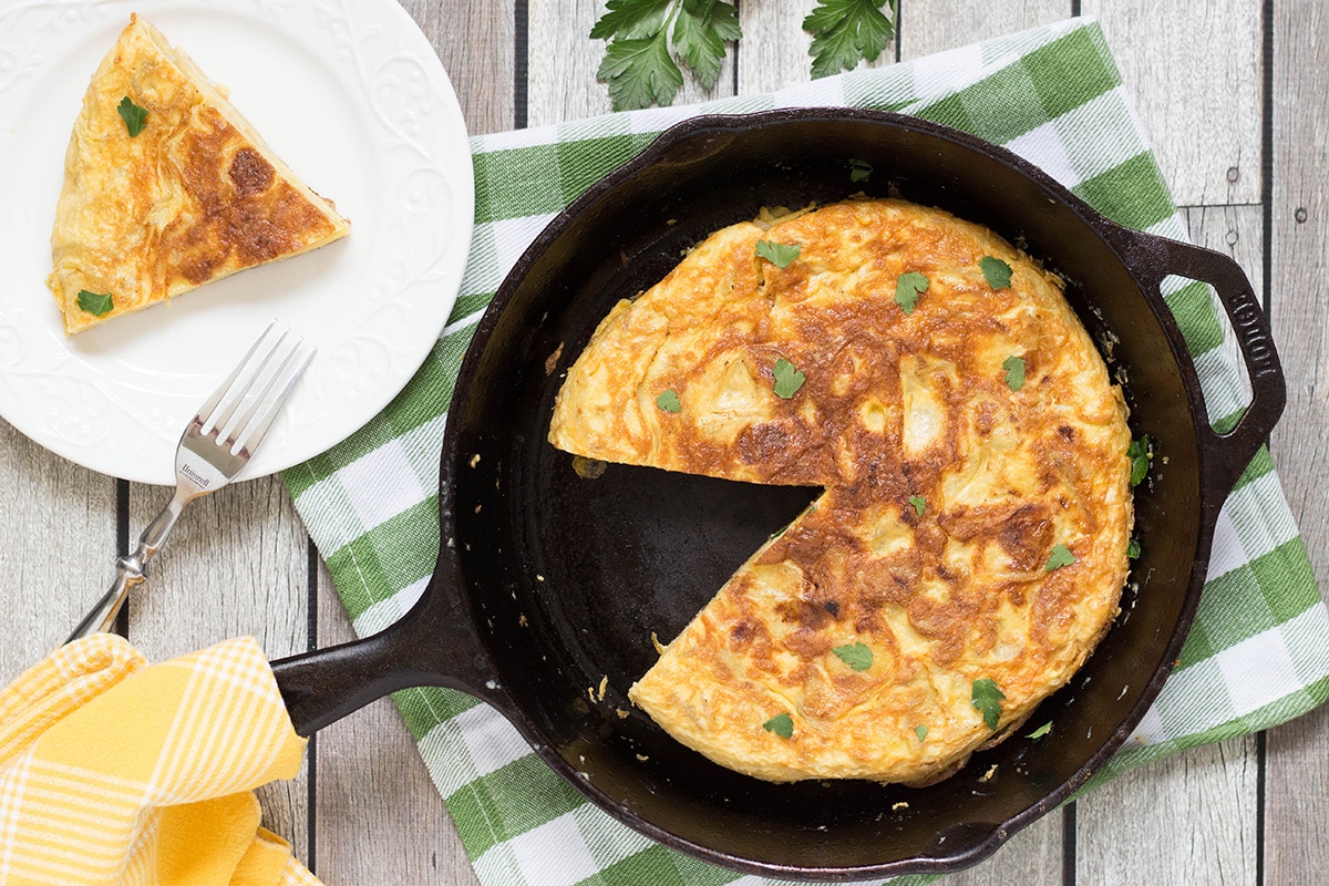 The famous Spanish Omelette (Tortilla) requires only few simple ingredients (eggs, potatoes, onion) and is so delicious!