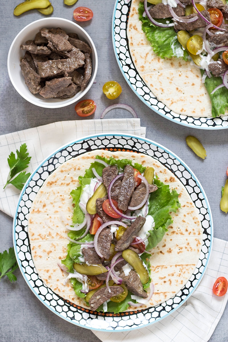 This Lebanese Beef Shawarma has everything you need: the tender meat, veggies, and the amazing tahini sauce. All this goodness wrapped in a pita bread. Perfection!