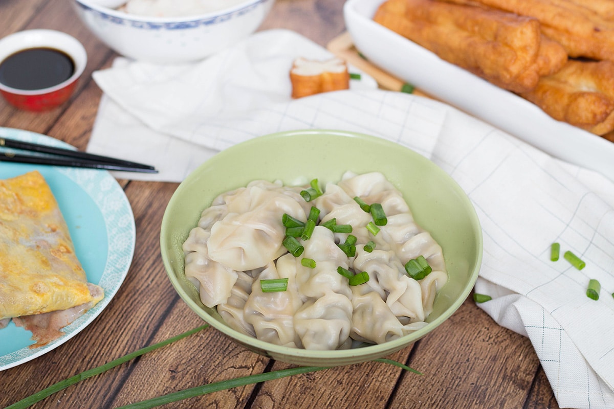 A look at the traditional Chinese breakfast including dumplings, rice porridge, fried bread sticks, and amazing crepes! | cookingtheglobe.com