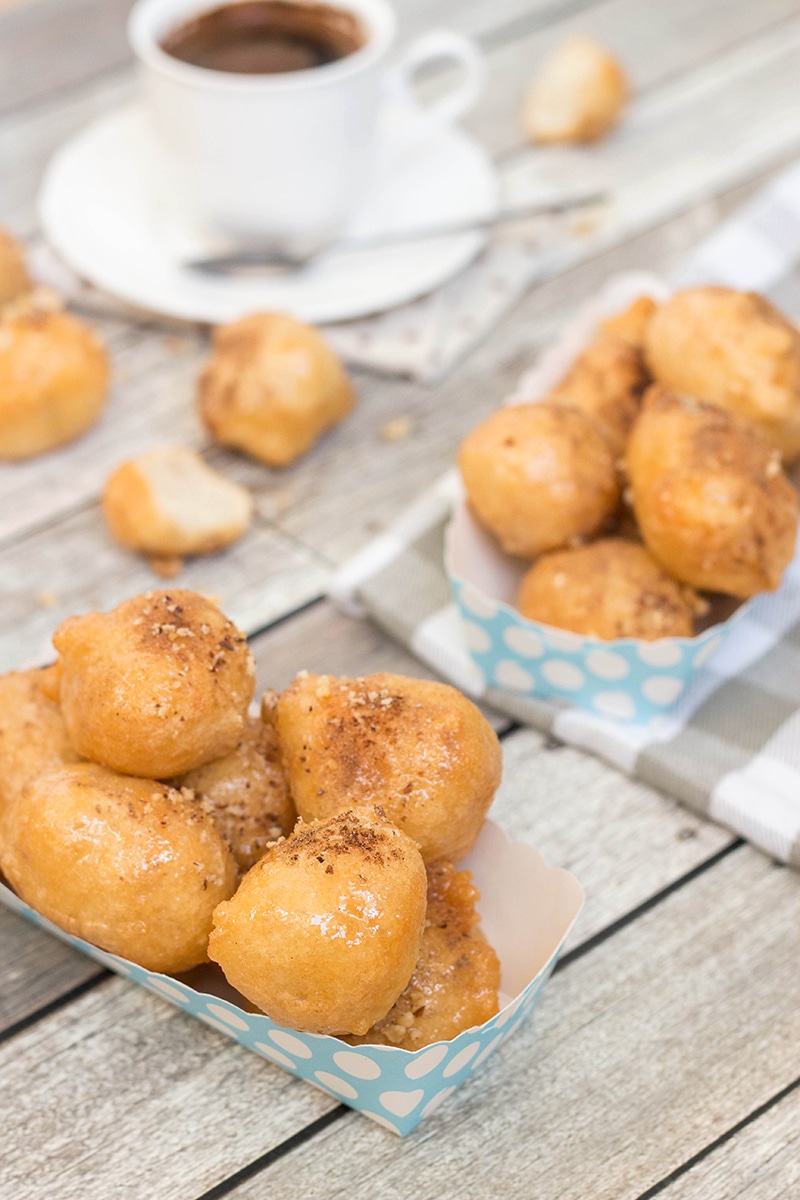 Check out these traditional Greek honey puffs (Loukoumades) sprinkled with cinnamon and walnuts. They are also called Greek donuts. Heaven for your taste buds!