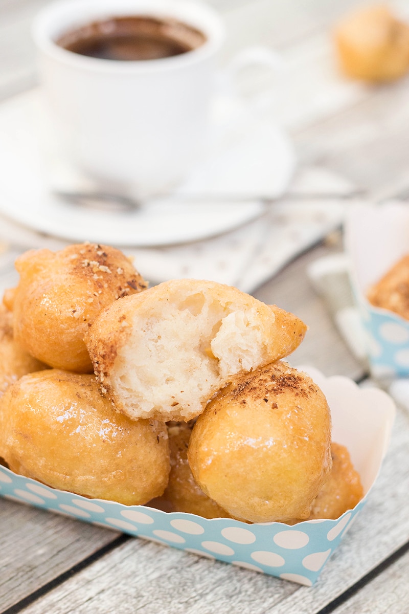 Check out these traditional Greek honey puffs (Loukoumades) sprinkled with cinnamon and walnuts. They are also called Greek donuts. Heaven for your taste buds!