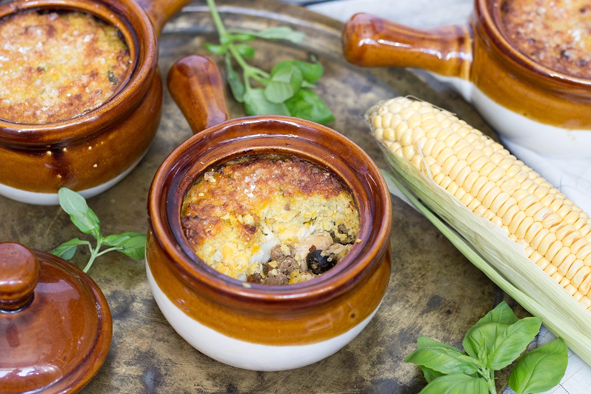 Pastel de Choclo is a famous South American pie, or casserole, stuffed with beef, chicken, eggs, and topped with a delicious corn paste! | cookingtheglobe.com