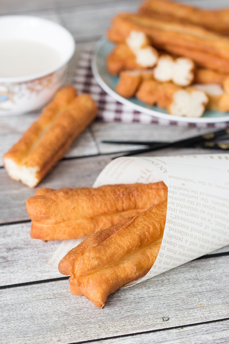 These Chinese Crullers, or Chinese donuts, called Youtiao, are a traditional breakfast staple in China. They can be enjoyed as a standalone dish or dipped in a warm soy milk! | cookingtheglobe.com