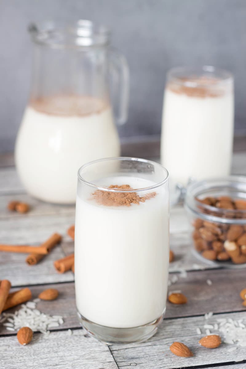 This authentic Horchata recipe has everything you need: rice, almonds, cinnamon, and lime zest mixed together to create a creamy, refreshing, thirst-quenching Mexican drink! | cookingtheglobe.com