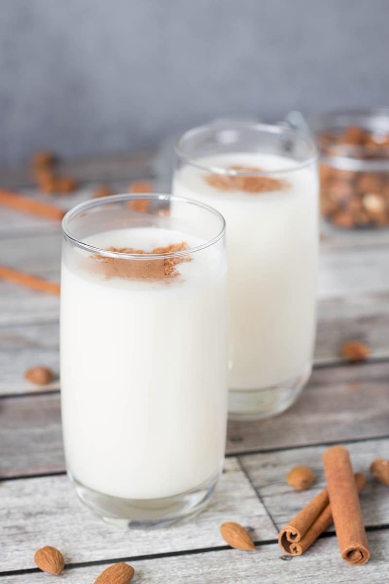 This authentic Horchata recipe has everything you need: rice, almonds, cinnamon, and lime zest mixed together to create a creamy, refreshing, thirst-quenching Mexican drink! | cookingtheglobe.com