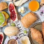 A look at the famous French breakfast, featuring a selection of breads and toppings, croissants, Pain au chocolat, and other goodies! | cookingtheglobe.com