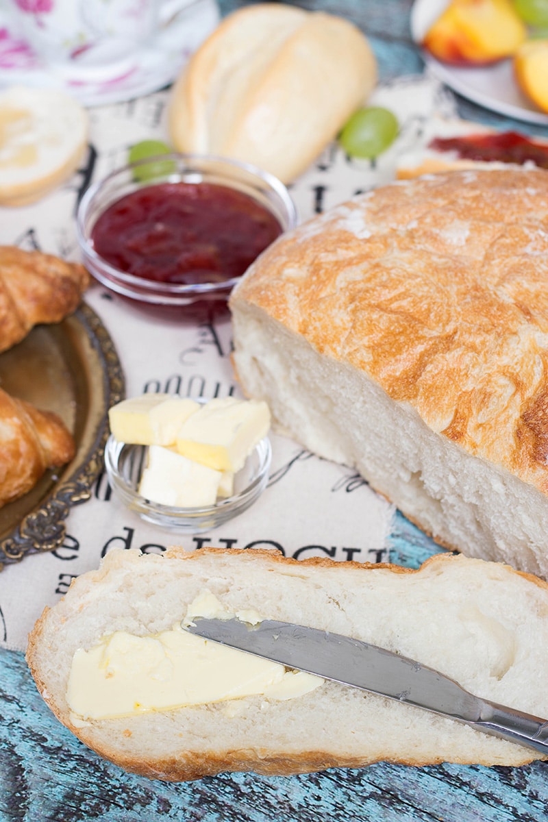 A look at the famous French breakfast, featuring a selection of breads and toppings, croissants, Pain au chocolat, and other goodies! | cookingtheglobe.com