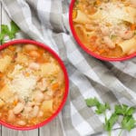 Pasta Fazool, also known by the name Pasta e Fagioli, is a classic Italian pasta and bean soup. It also features Parmesan cheese, tomatoes, and tons of other veggies! | cookingtheglobe.com